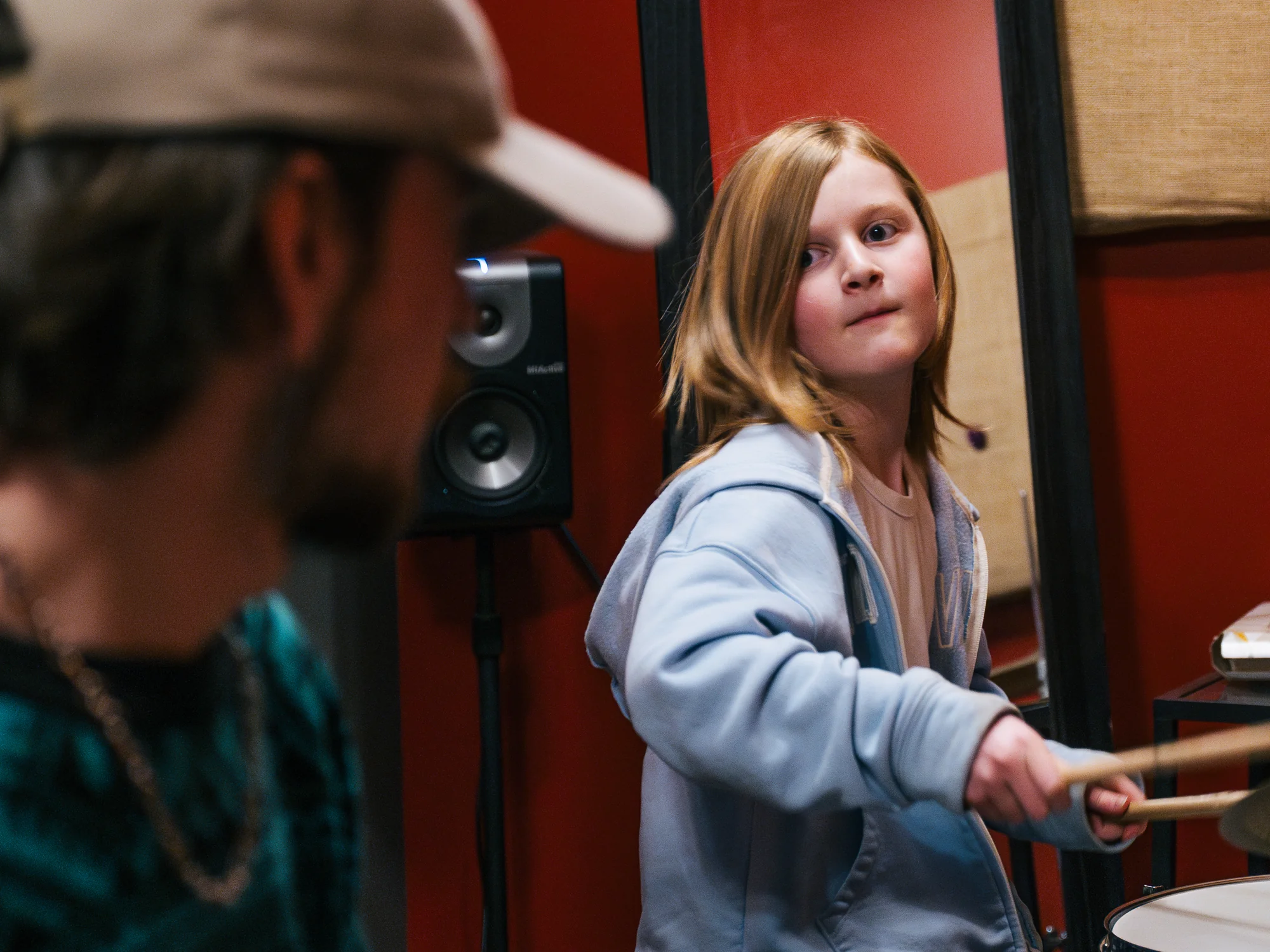 Drum student at the kit with her teacher during a lesson at Resonate in Edmonton