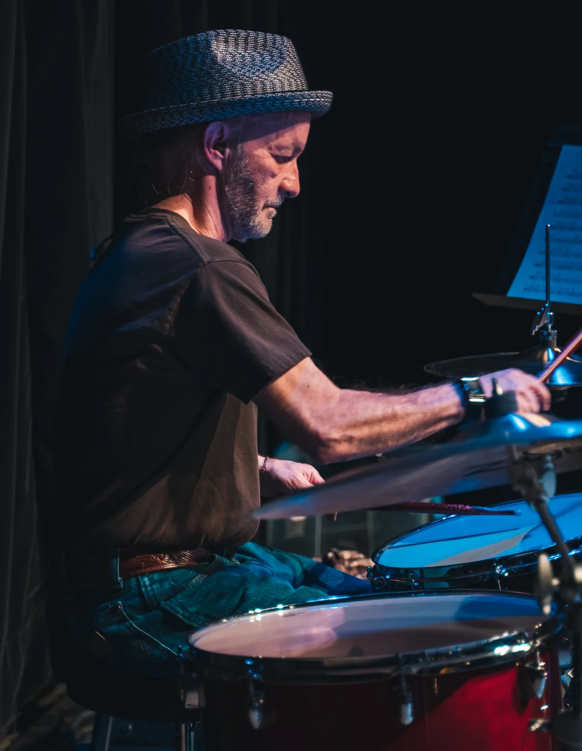 Seasoned drummer performing on stage at Resonate in Edmonton