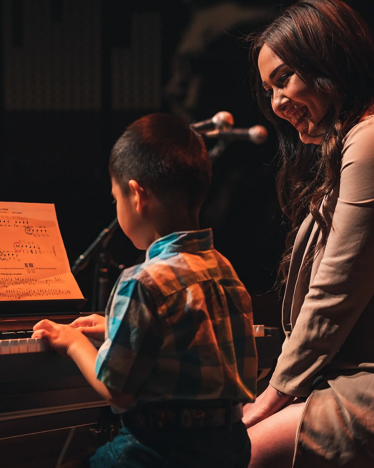 Teacher and student at piano during a lesson at Resonate