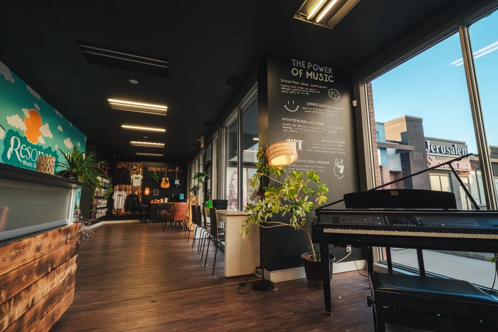 The Resonate lobby with a grand piano by the front windows