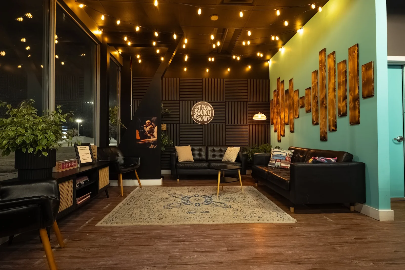 The waiting area at Resonate lit warmly at night